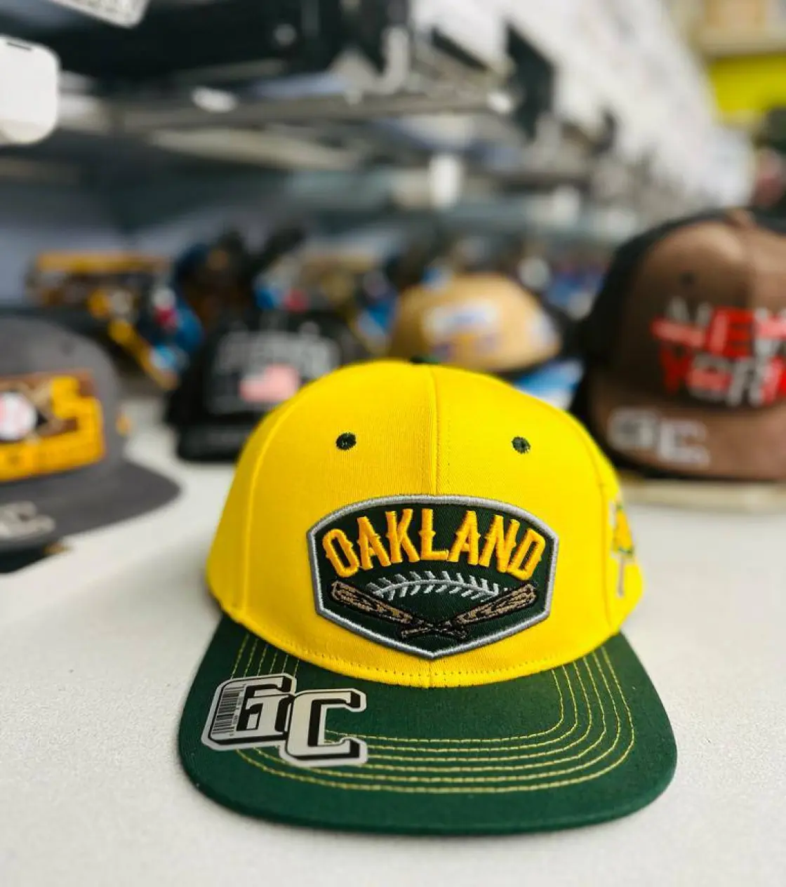 Yellow hat with Oakland embroidery