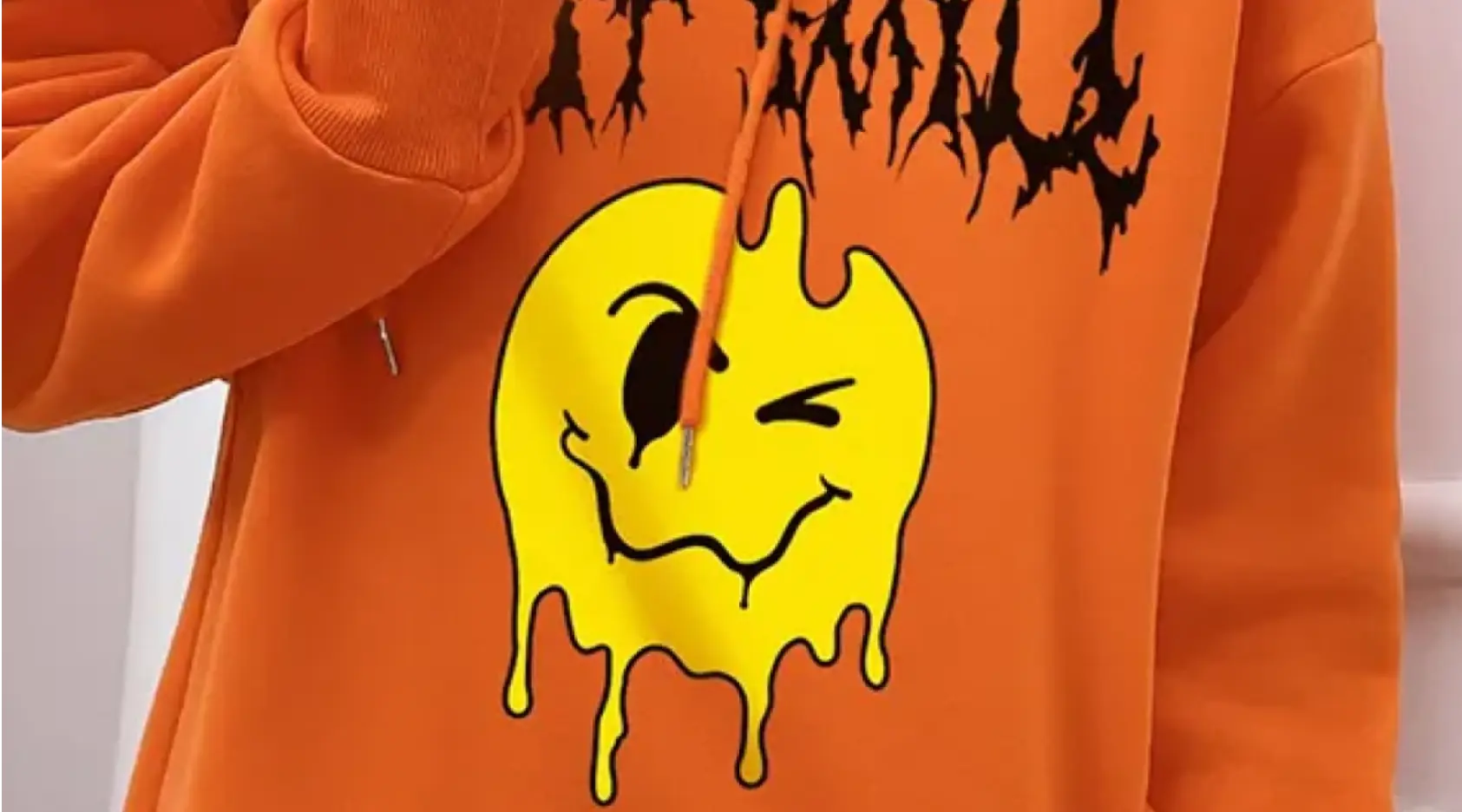 Orange hoodie with a smile print on it