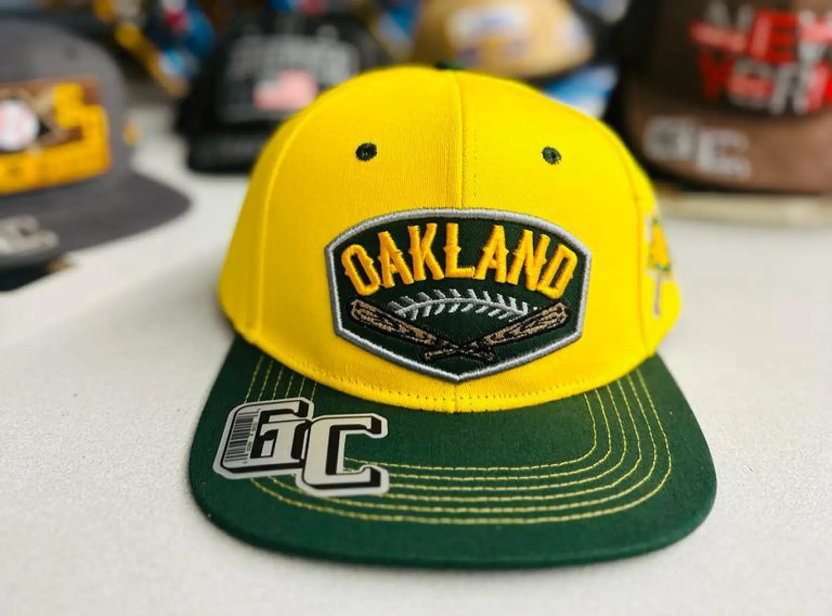Yellow and green Oakland cap