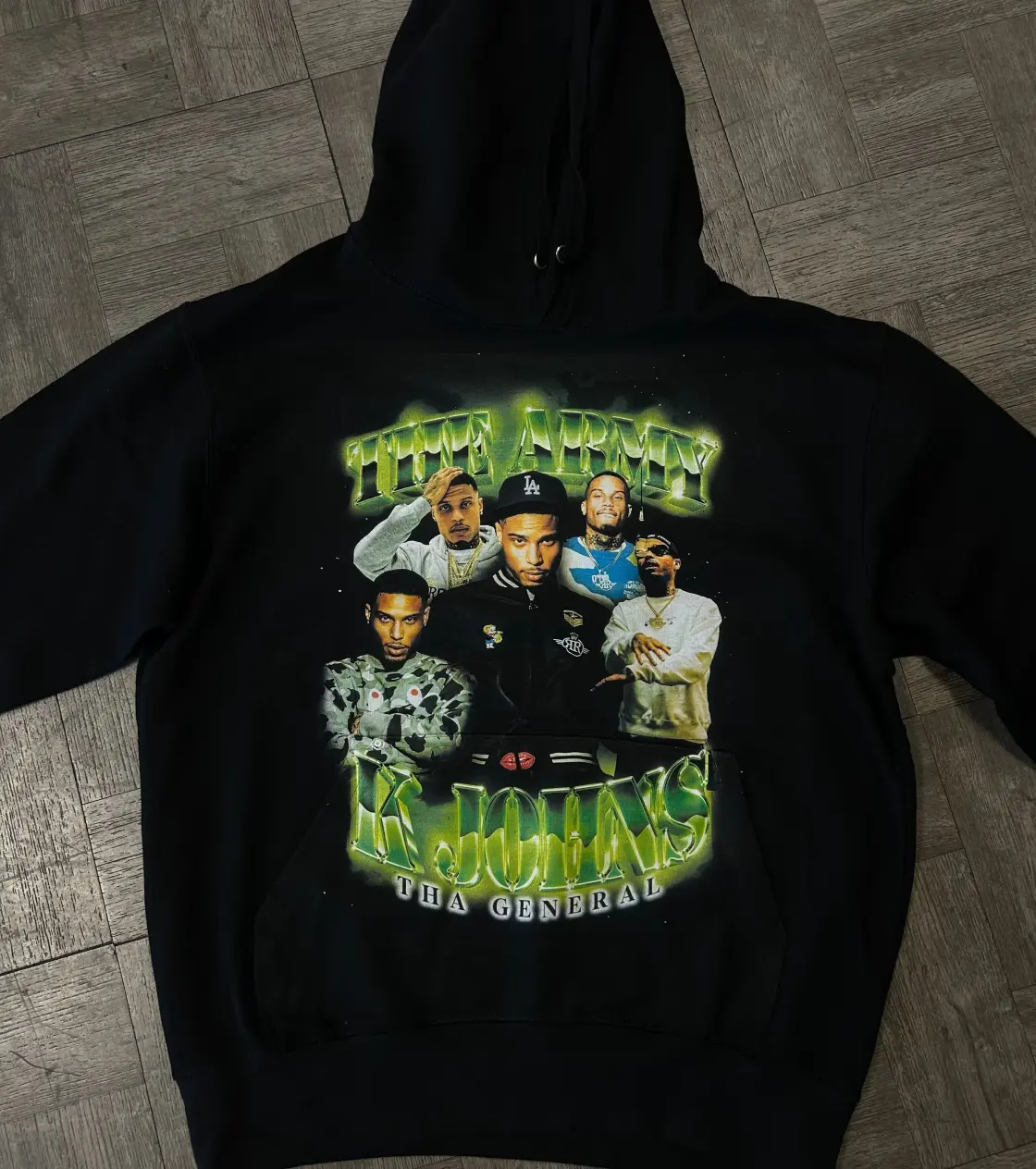Black hoodie with a few men figures on it